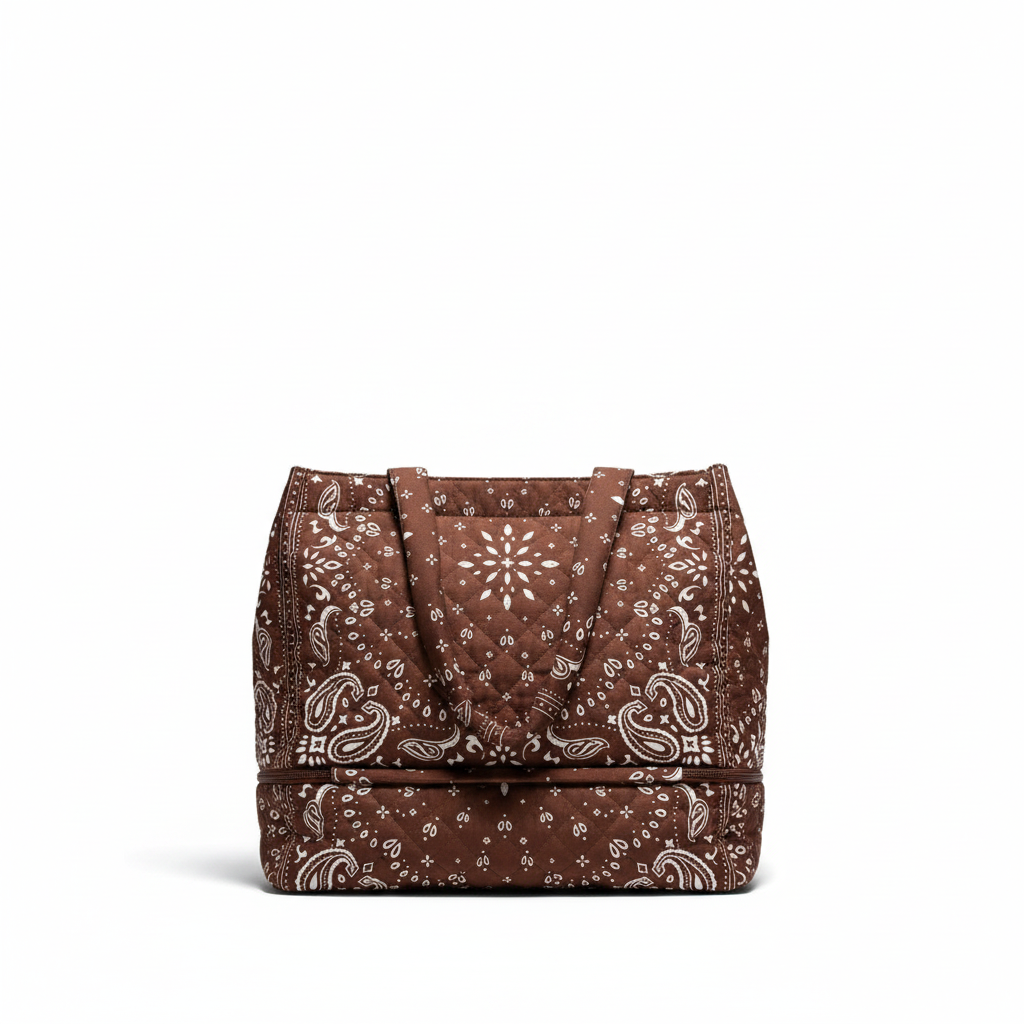 Little Ocean quilted tote bag in brown and white with a bandana-inspired paisley print and zippered bottom section.