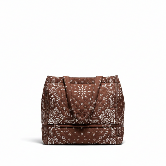 Little Ocean quilted tote bag in brown and white with a bandana-inspired paisley print and zippered bottom section.