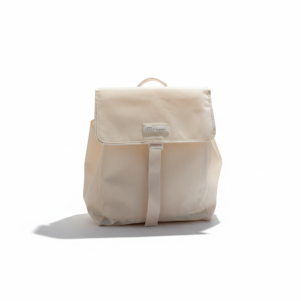 Little Ocean The Everything Beach Bag in cream mesh with adjustable straps and a spacious 60L capacity.